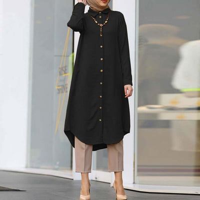 Women's black lapel casual long sleeve shirt with buttons, styled with beige pants and a necklace.