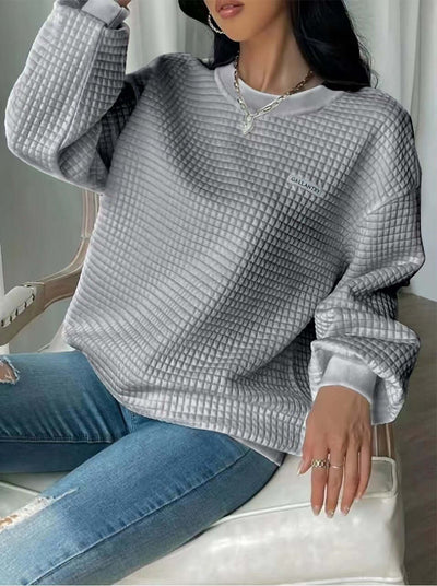 Women's loose-fit gray waffle pullover sweatshirt with drop-shoulder sleeves and casual style.
