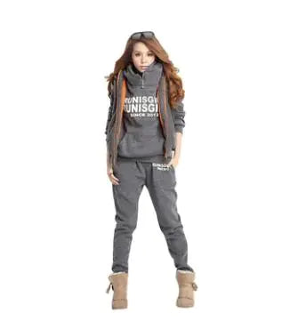 Ladies' Athletic Gear - Activewear Combo showcasing a woman in stylish gray sports set and boots, ideal for workouts and casual wear.