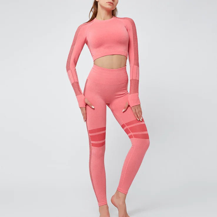 Chic women's yoga gear featuring a pink two-piece tracksuit, perfect for stylish workouts and yoga sessions.